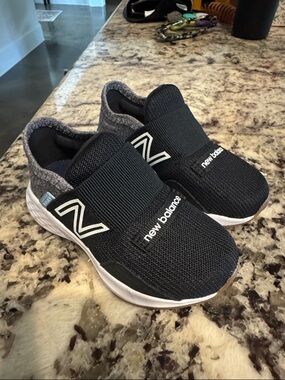 New Balance Black and White Slip-On Kids' (BABY WALKER) Sneakers